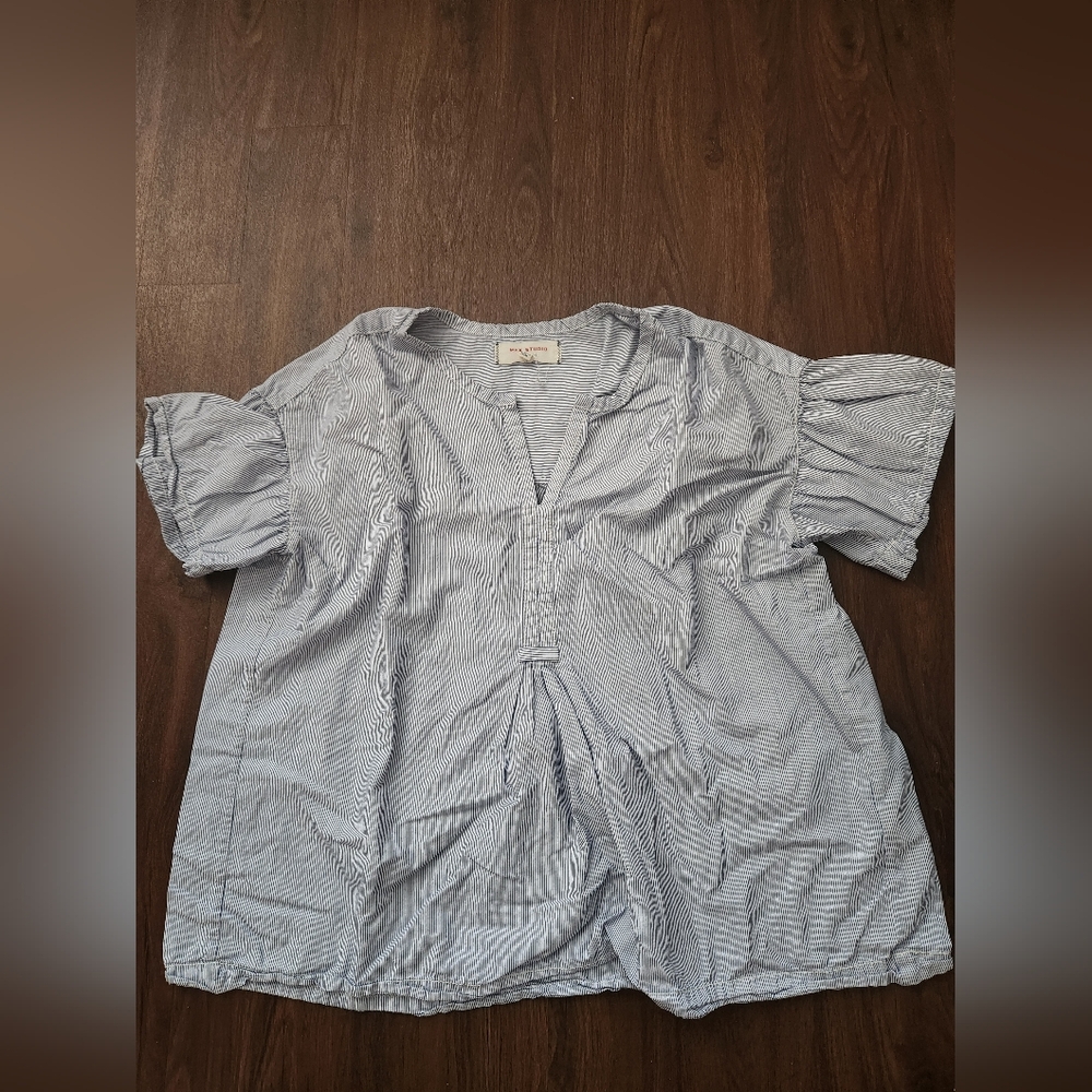 Ruffled blue white stripes shirt with a button